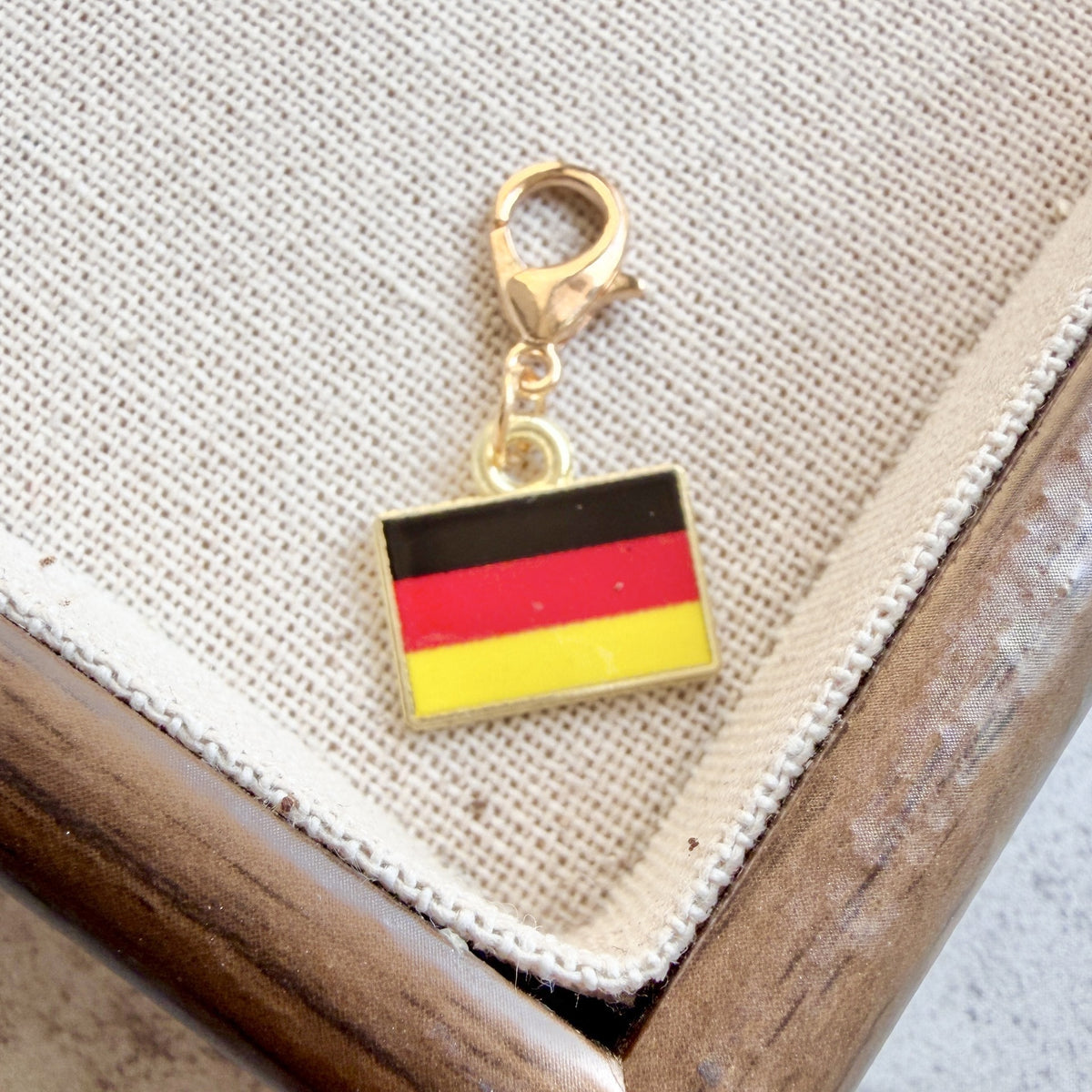 Germany enamel country flag keychain charm on a gold tone lobster clasp for keys and bags