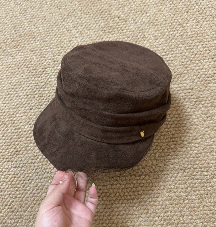 Vegan suede flat top cap in dark brown shown on a mannequin head