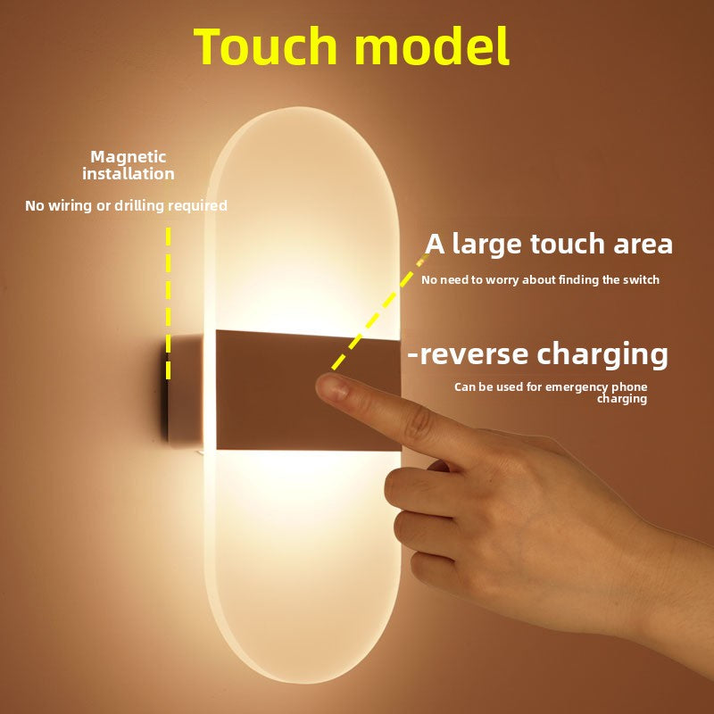 LED wall sconce giving ambient light up a staircase wall