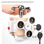 Child hand turning the chrome faucet on the wooden Unlock busy cube with white spinner discs and keys
