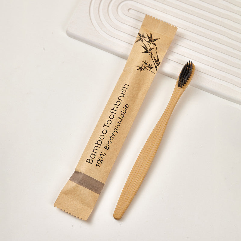 Single colored bristle bamboo toothbrush photographed on a plain surface
