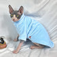 Sphynx cat wearing a soft mink velvet turtleneck sweater in taupe brown