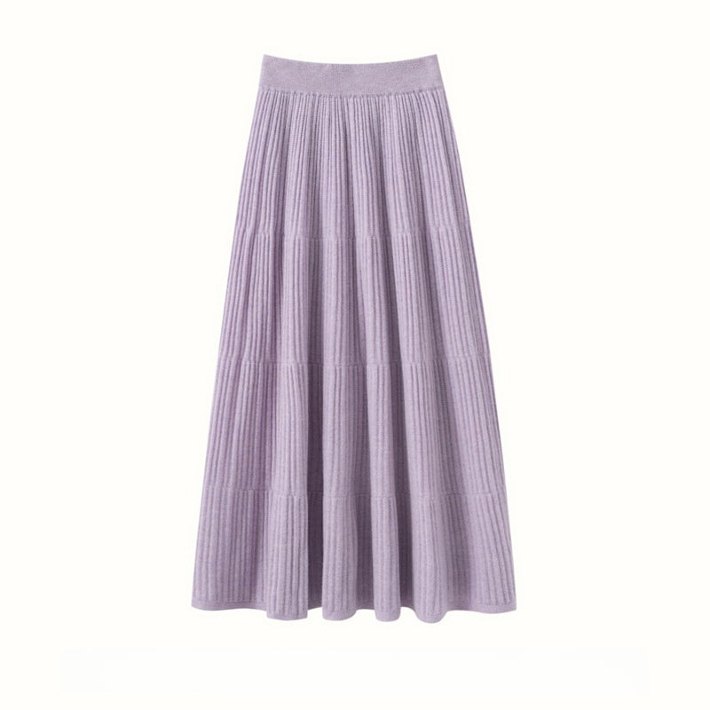 Lilac ribbed A-line midi skirt with tiered seams and a wide waistband, flat view on a white background