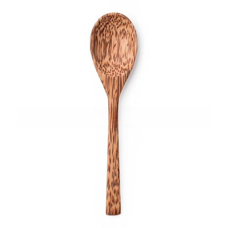 Coconut wood spoon with a long handle and speckled brown grain on a white background