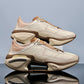 Gradient sneaker on the foot showing the chunky cutout sole and the laced upper