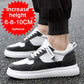 White and charcoal low-top sneakers with a chunky white sole, worn with black joggers on a street, with a height badge