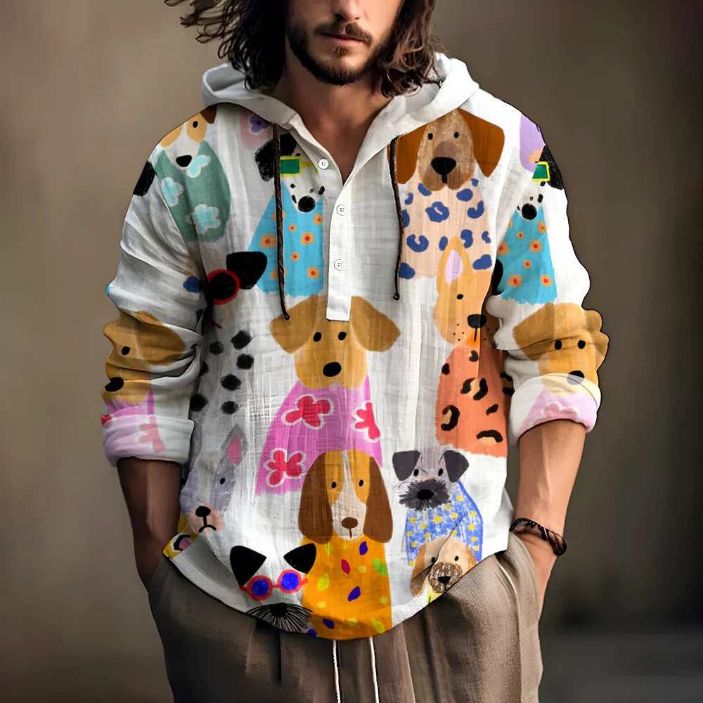 Man wearing a white hooded henley shirt covered in a colorful dog illustration print