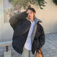 Oversized cotton padded puffer coat with stand collar and checkerboard lining, brown, on a model