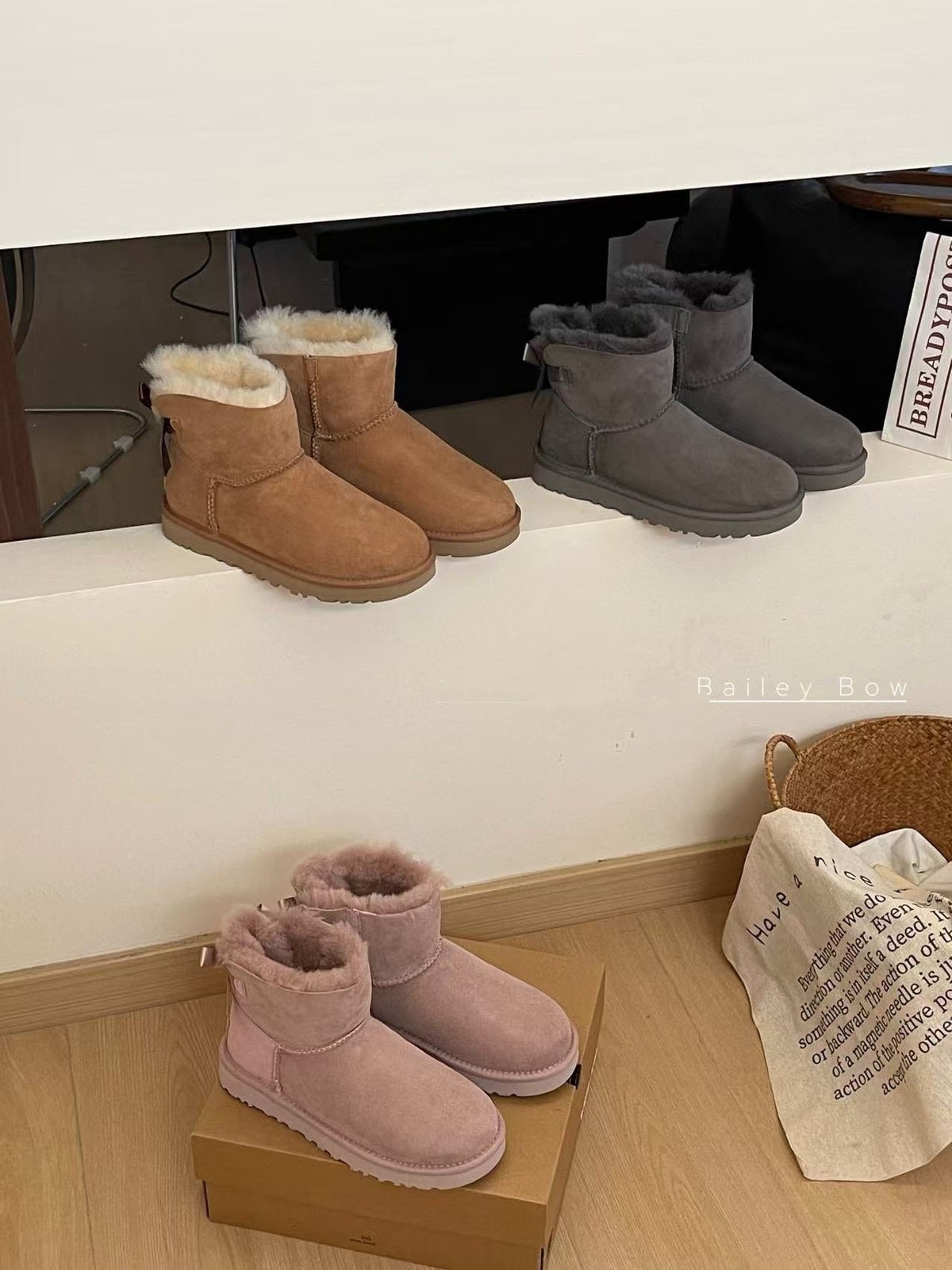 Chestnut, gray and pink ankle boots with shearling cuffs lined up on a white shelf, Gray Thin Sole option, size 35