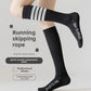 Model wearing black long tube compression socks with white stripes for running and skipping rope