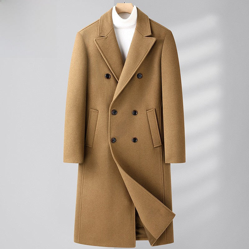 Camel double breasted wool blend coat with a peak lapel on a soft gray studio background