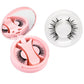 Pink round magnetic lash case with clip beside a full black magnetic lash style in a ring