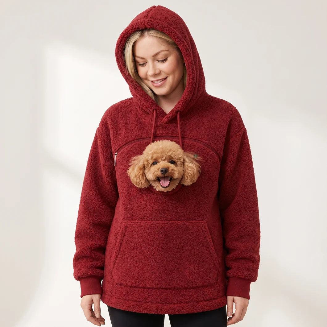 Dark red teddy fleece hoodie with the hood up and a small dog's head showing through the chest opening