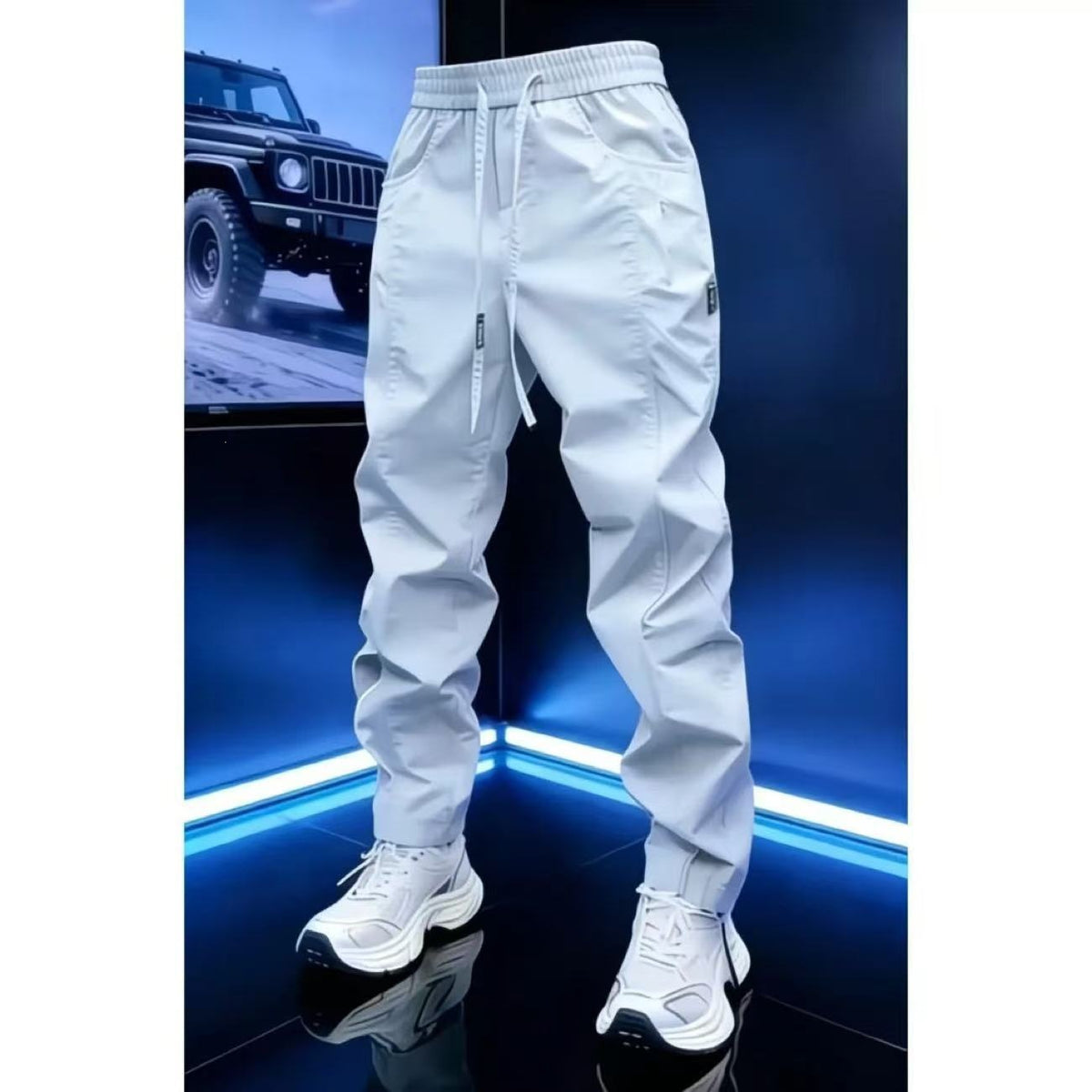 White drawstring jogger pants with elastic waist and tapered legs, size 29 option