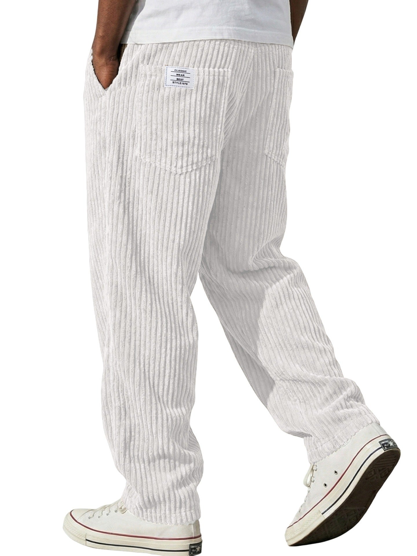 Back view of the wide wale corduroy trousers showing patch pockets and a woven flag label