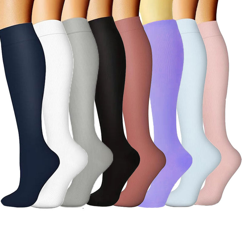Patterned compression socks lined up to show calf coverage and knee-high length