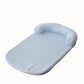 Cool touch pet bed mat with a raised headrest bolster on one long side