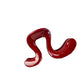 Close view of the large wavy acrylic hair claw clip and its glossy curved arms