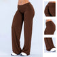 Woman in chestnut brown wide leg pants with three detail panels showing the back, the side and the hem