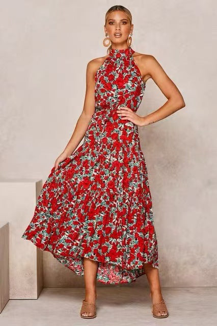 Red floral halter neck sleeveless tiered swing maxi dress worn by a model