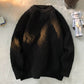 Black heavyweight round neck knit pullover with a raised basketweave jacquard texture