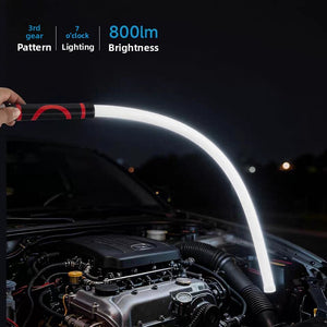 Bendable LED work light glowing white while lighting an open car bonnet