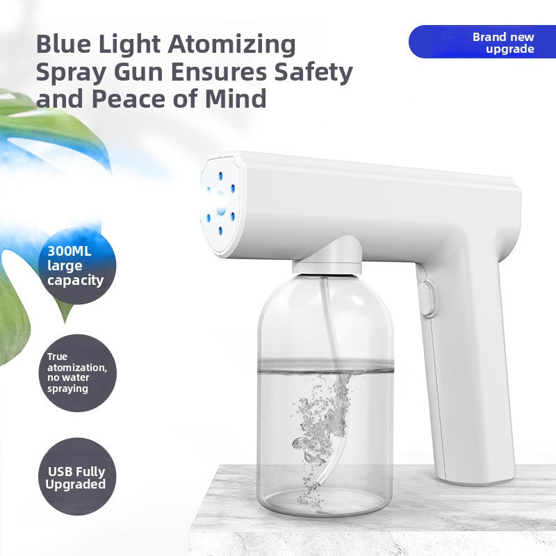Six blue light ring around the outlet of the handheld atomizing spray gun