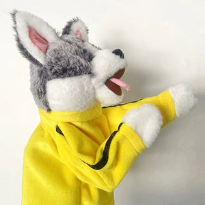 Close view of the grey and white plush dog head and yellow velvet sleeve with black side stripe