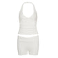 Flat lay of the cream white halter top and high-waist shorts two-piece set
