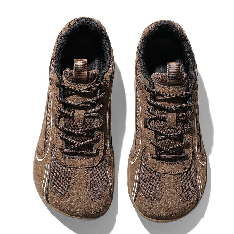 Pair of brown mesh sneakers with a roomy round toe box and brown laces, seen from above on white