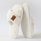 Beige crossed plush open toe slipper standing beside its textured TPR sole, size 42-43 option
