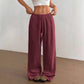 Close view of the elastic drawstring waistband on the wide leg cotton trousers