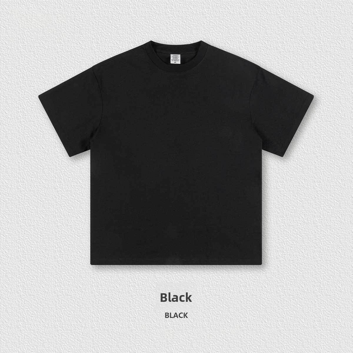 Close view of the thick 305g cotton knit and ribbed crew neckline on the oversized tee