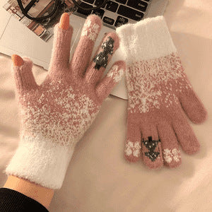 Pink fuzzy knit touchscreen gloves with snowflake pattern and small tree embroidery