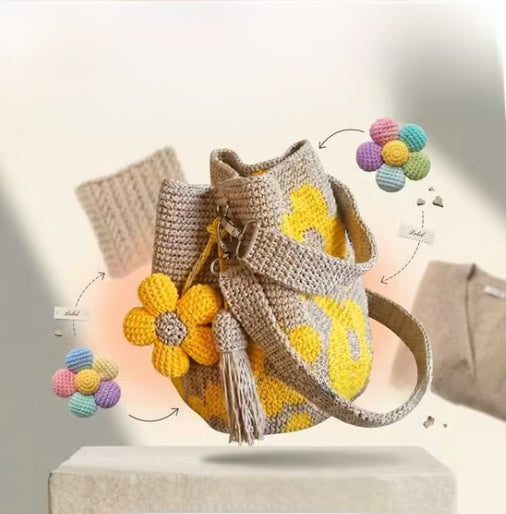 Yellow floral crochet cotton bucket bag with a detachable flower and tassel charm