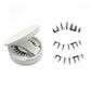 Magnetic false lashes and shaped applicator clip laid out together