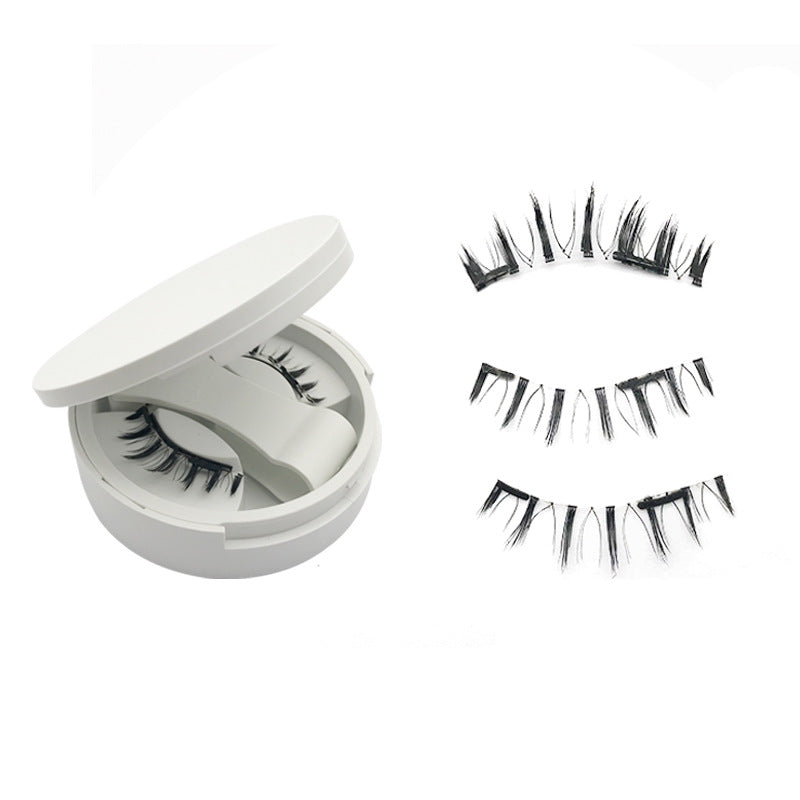 Magnetic false lashes and shaped applicator clip laid out together
