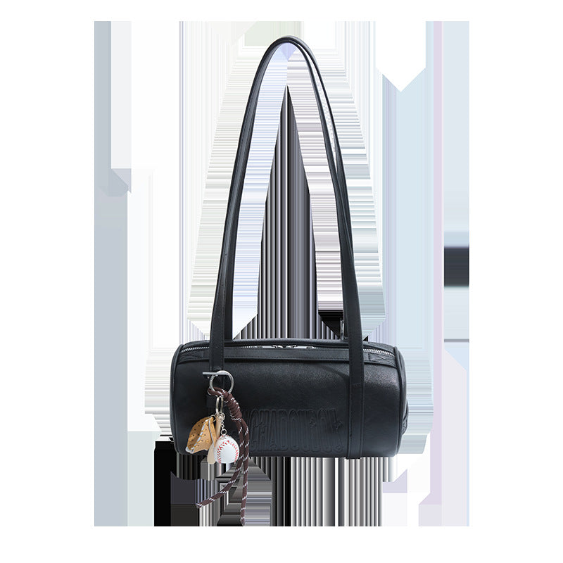 Black cylinder shoulder bag with two long straps and a baseball glove charm on white, option Black