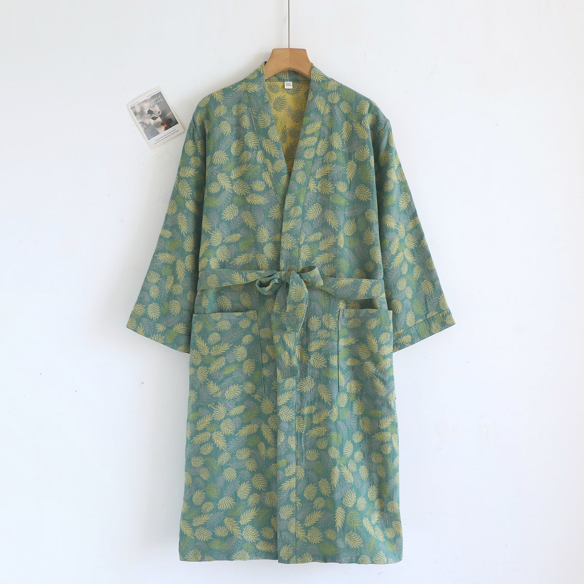 Close view of the double layer cotton gauze fabric with a two tone leaf print on the kimono robe