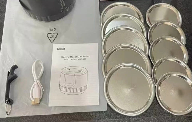 Mason jar of coffee beans kept fresh beside the compact electric vacuum sealer