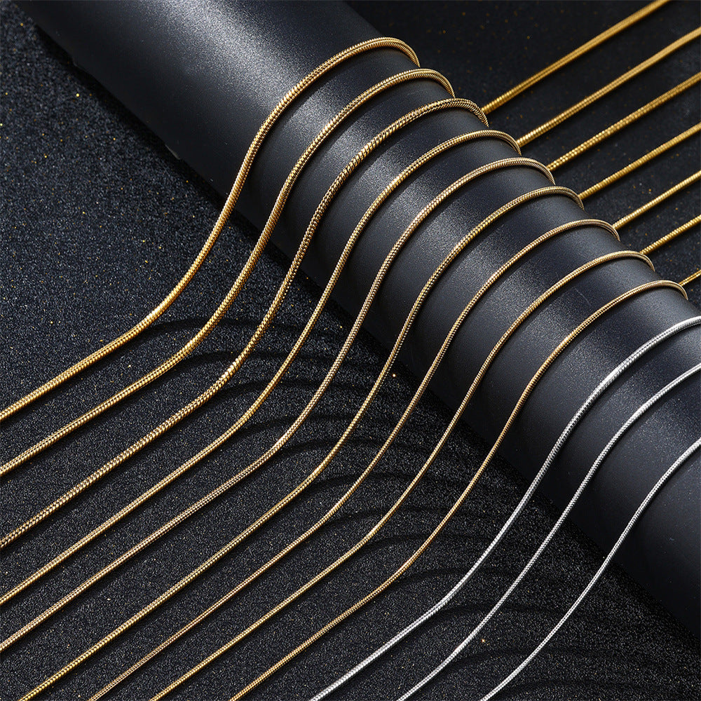 Stainless steel snake bone necklace shown worn against the collarbone