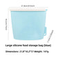 Reusable blue silicone food storage bag, 1200ml size, standing sealed upright