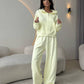 Pale yellow zip front hooded sweatshirt and wide leg trousers set, Yellow color, worn by a model, the Size XL option
