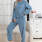 Woman in a blue coral fleece pajama set with a cable-like jacquard texture, round neck, long sleeves and matching trousers