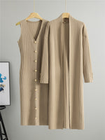 Khaki ribbed knit set, a sleeveless V neck button front dress and a long open cardigan on hangers