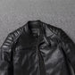Close-up of a black jacket stand collar with a snap tab, quilted shoulder and a slanted chest zip pocket