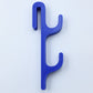 Blue resin single sided double hook with two arms stacked, seen from the front on a light background