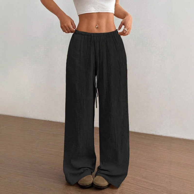 Full length view of wide leg palazzo cotton trousers falling to the floor