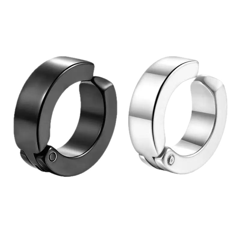 Pair of clip on ear cuffs, one black and one polished steel, showing the open C shape and the hinge pin