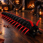 Red version: black padded centipede costume with red legs and antennae worn by a black cat on a wood floor